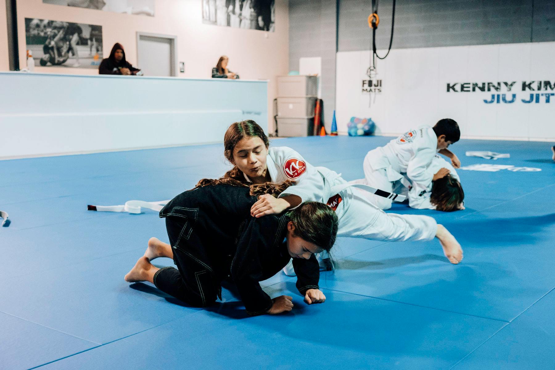 Students training in gi at Kenny Kim BJJ